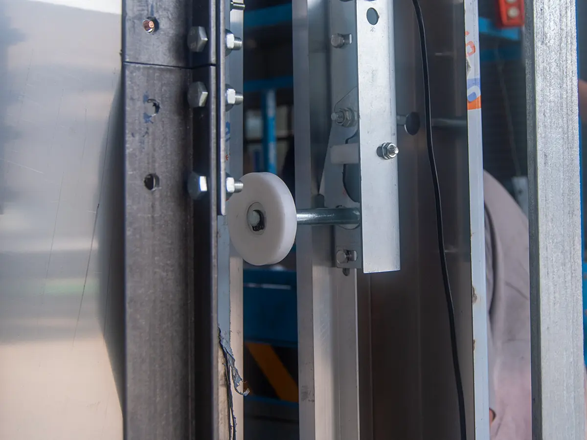 Electrical control cabinet of a commercial dumbwaiter housing the PLC, inverter and safety relays that run the lift