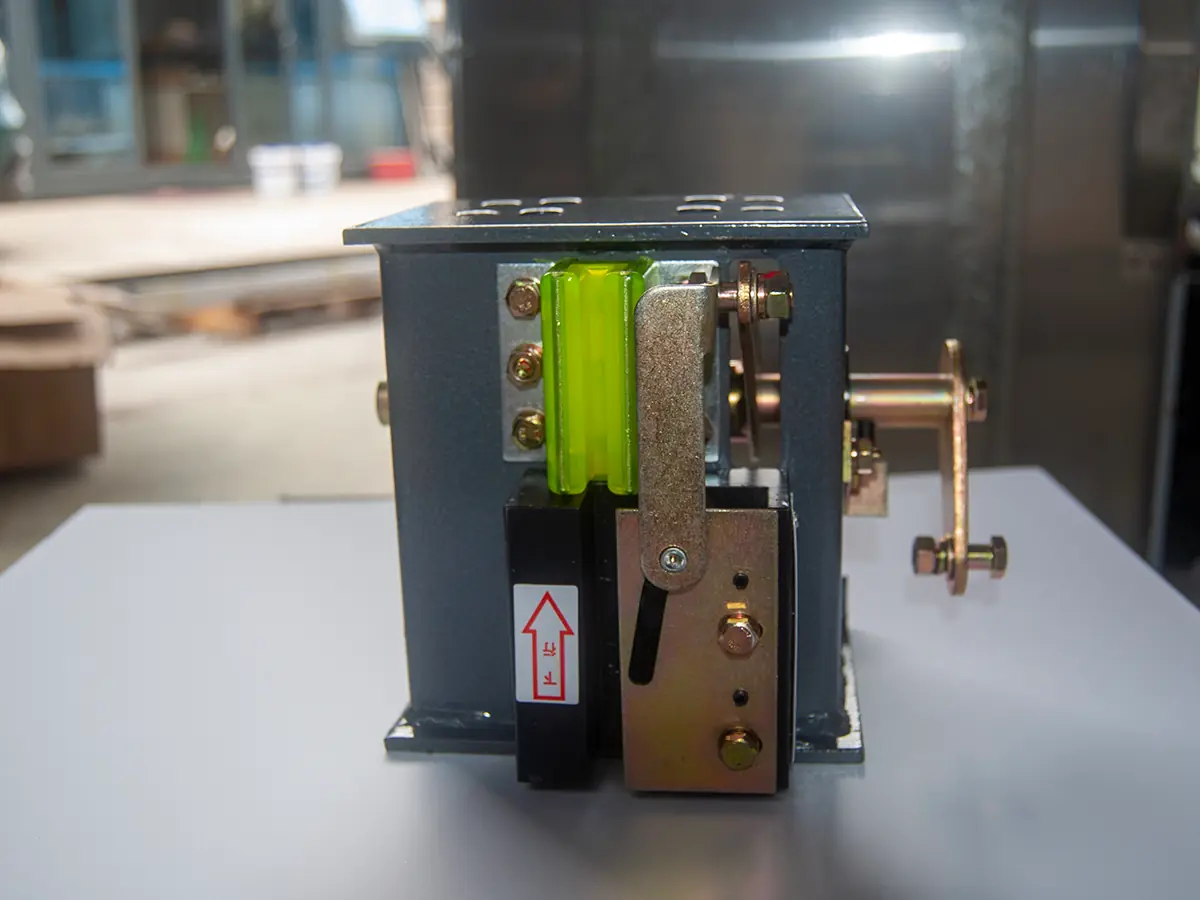 Inside view of a dumbwaiter drive system showing ropes, counterweight, and control components for servicing