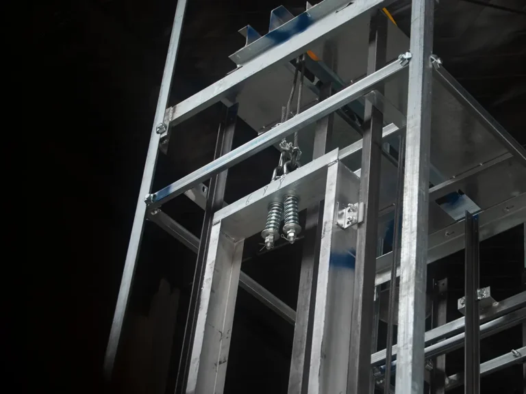 Commercial dumbwaiter manufacturing workshop where units are assembled, wired, and quality-checked before shipping