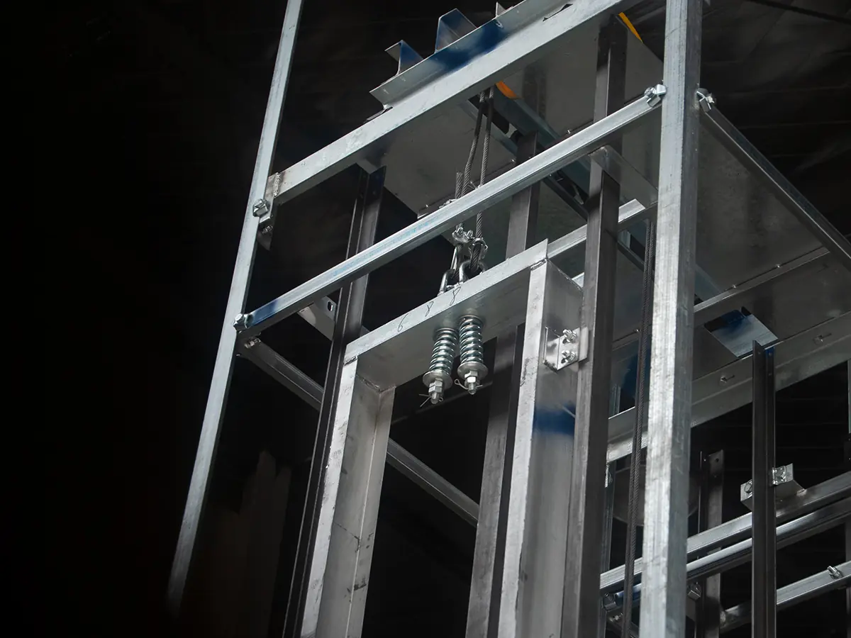 Commercial dumbwaiter manufacturing workshop where units are assembled, wired, and quality-checked before shipping