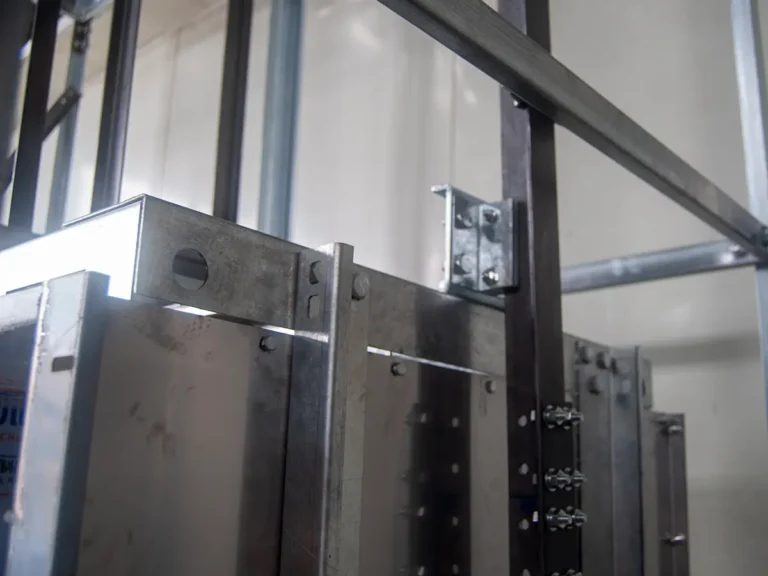 Electric commercial dumbwaiter unit showing the motor and control system that need regular maintenance
